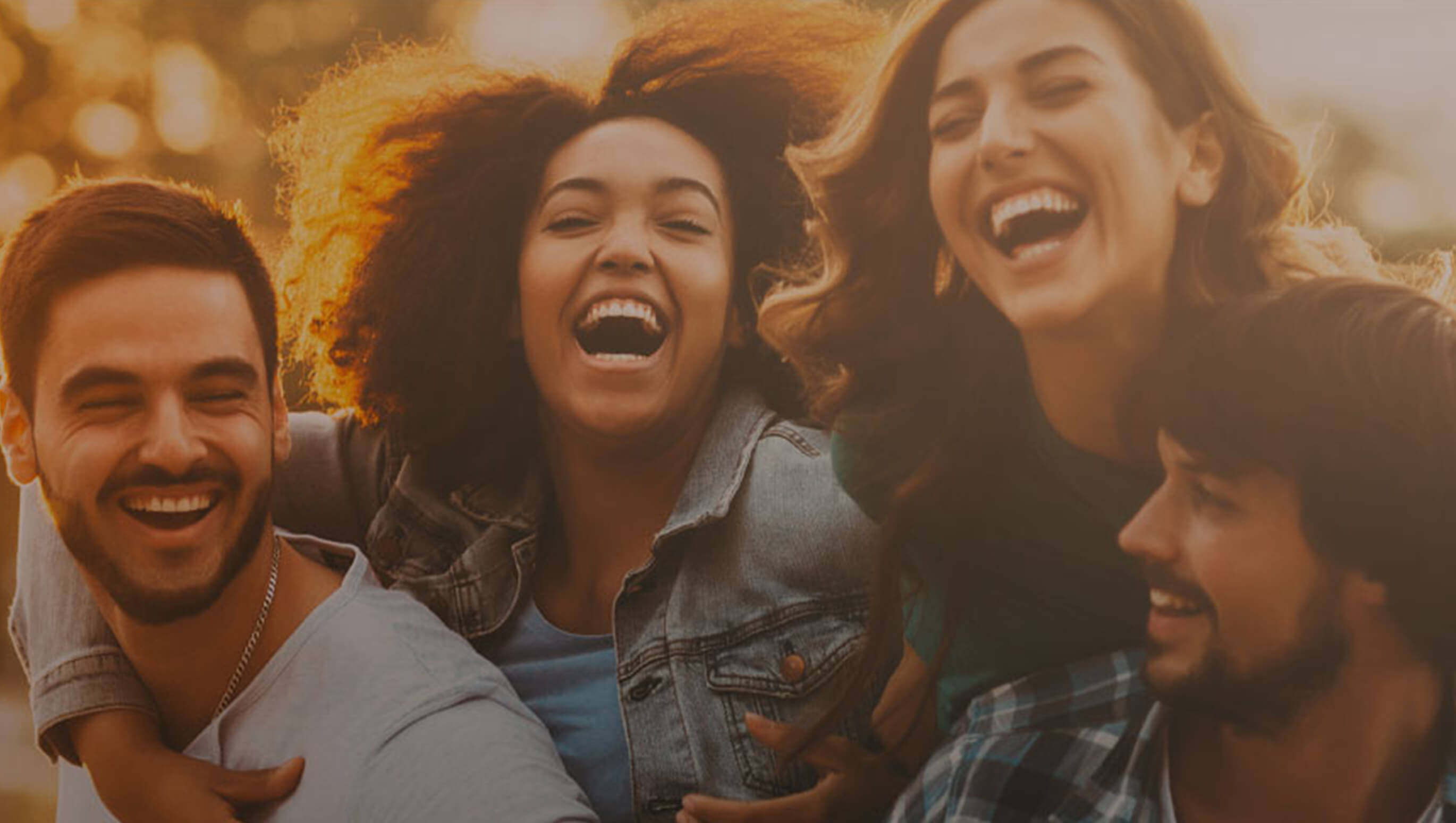 Group of four friends laughing
