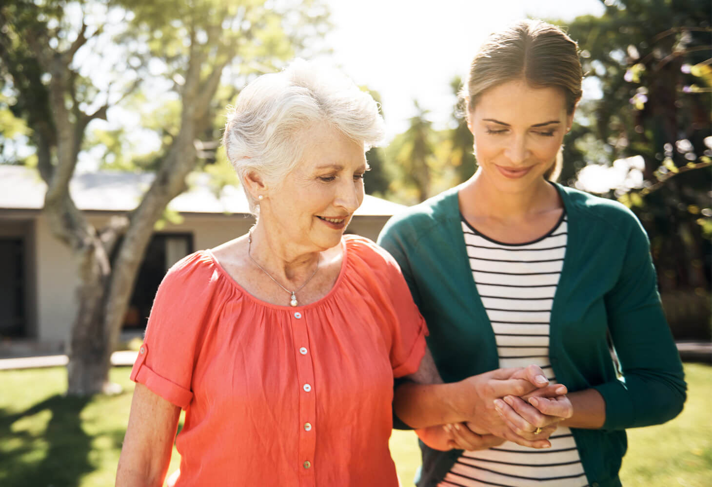 Younger woman supporting older woman 