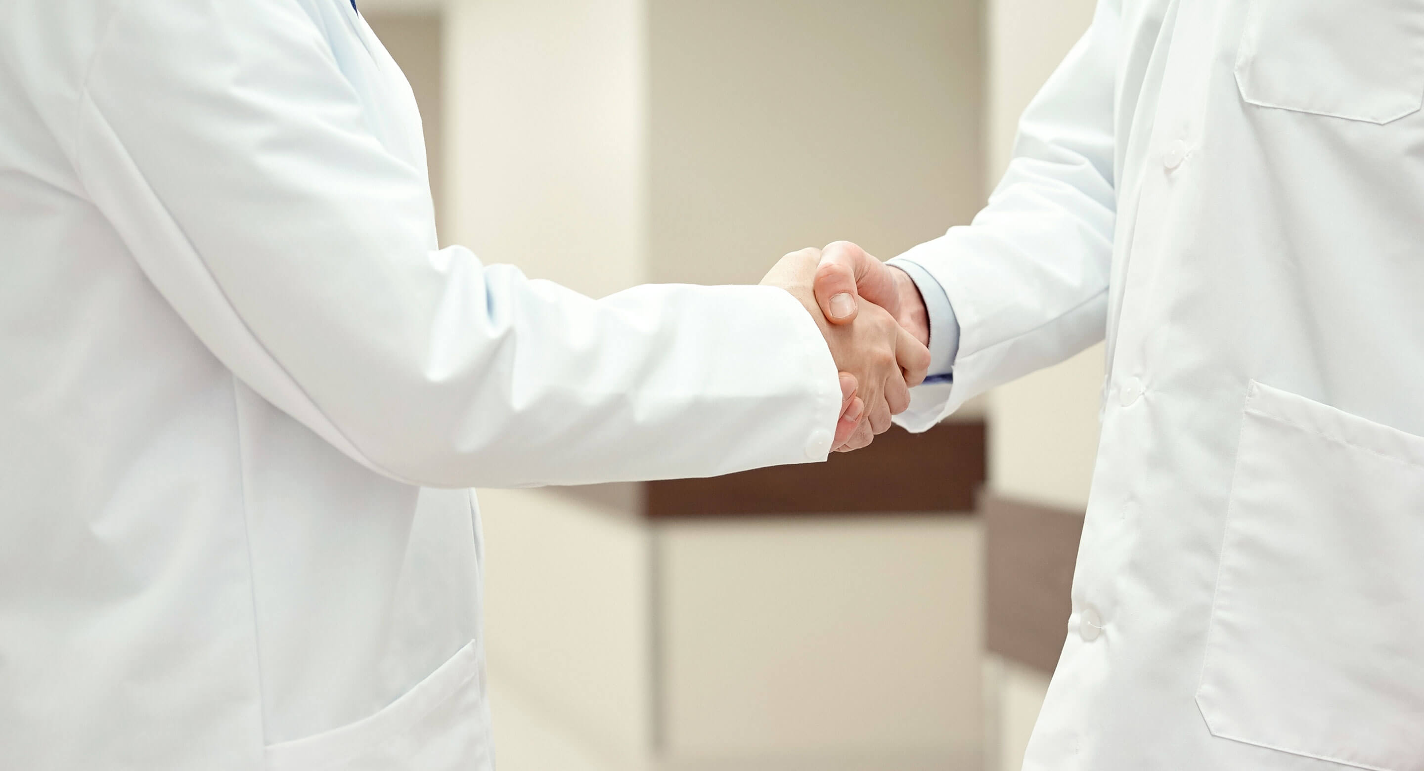 medical professionals shaking hands