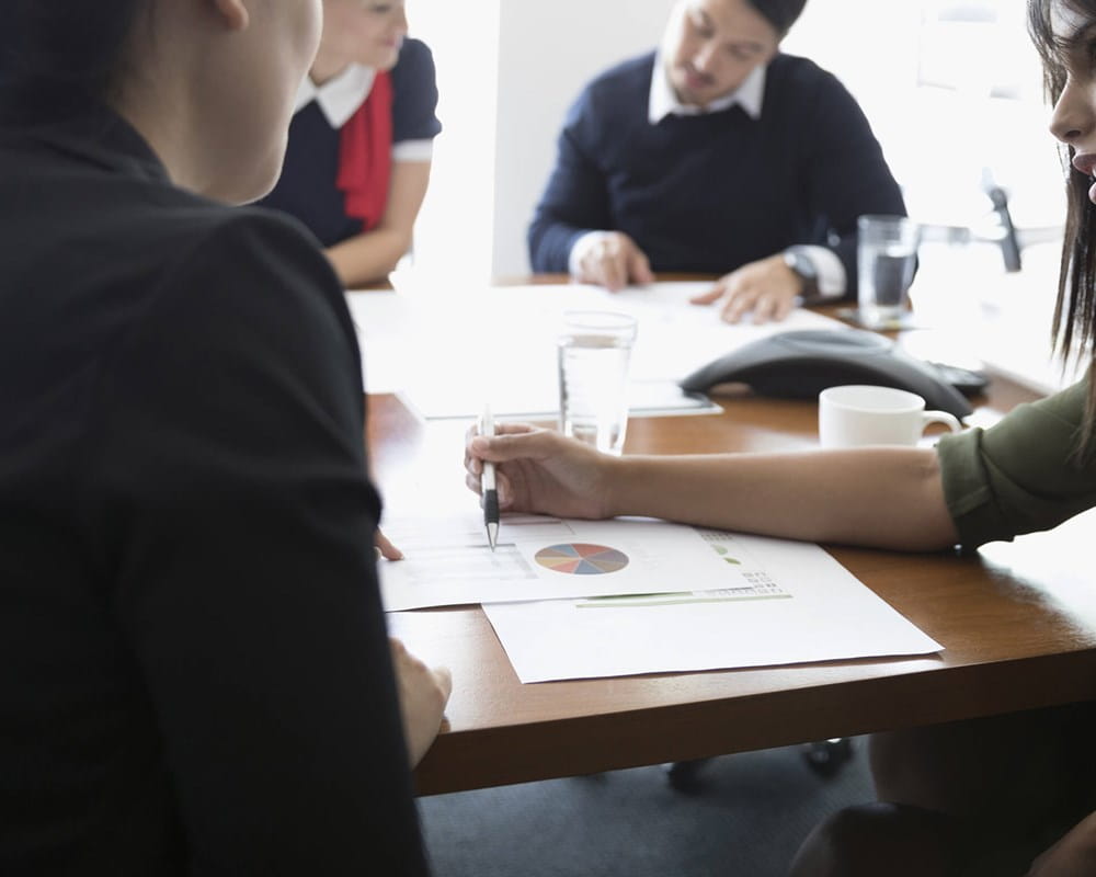 Women reviewing analytics at a meeting