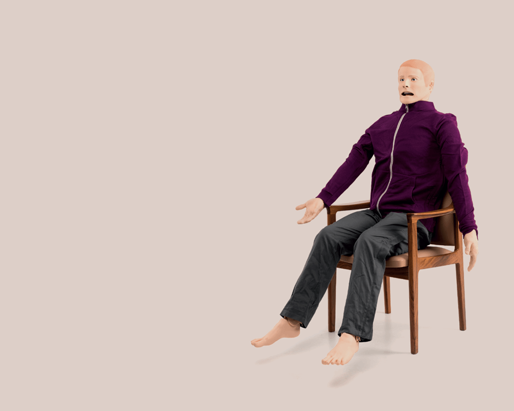 Simpson the SimMan dummy sitting in a chair