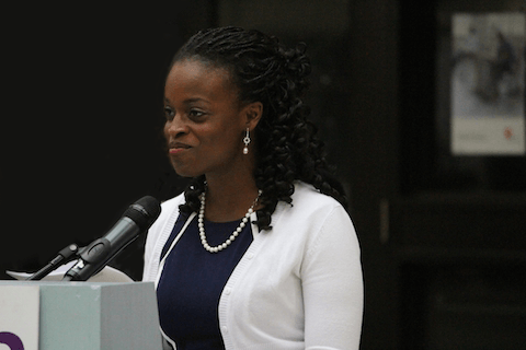 CAMH Occupational Therapist, Joy-Ann Perry​ speaking behind a podium.