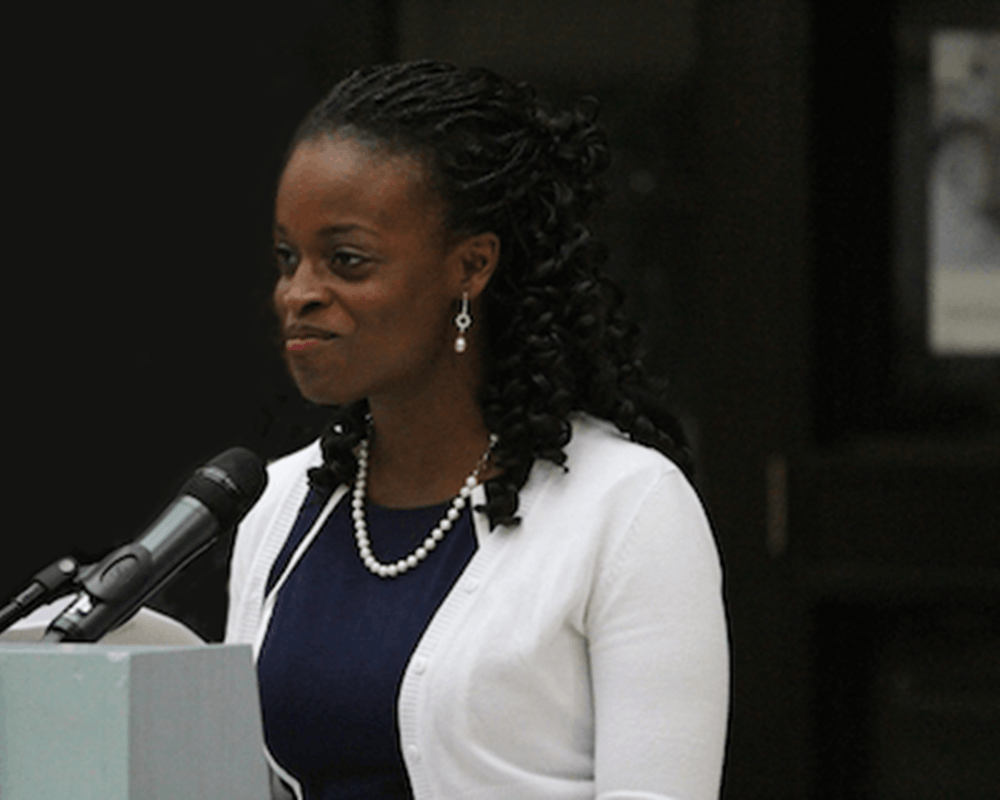 CAMH Occupational Therapist, Joy-Ann Perry speaking behind a podium.