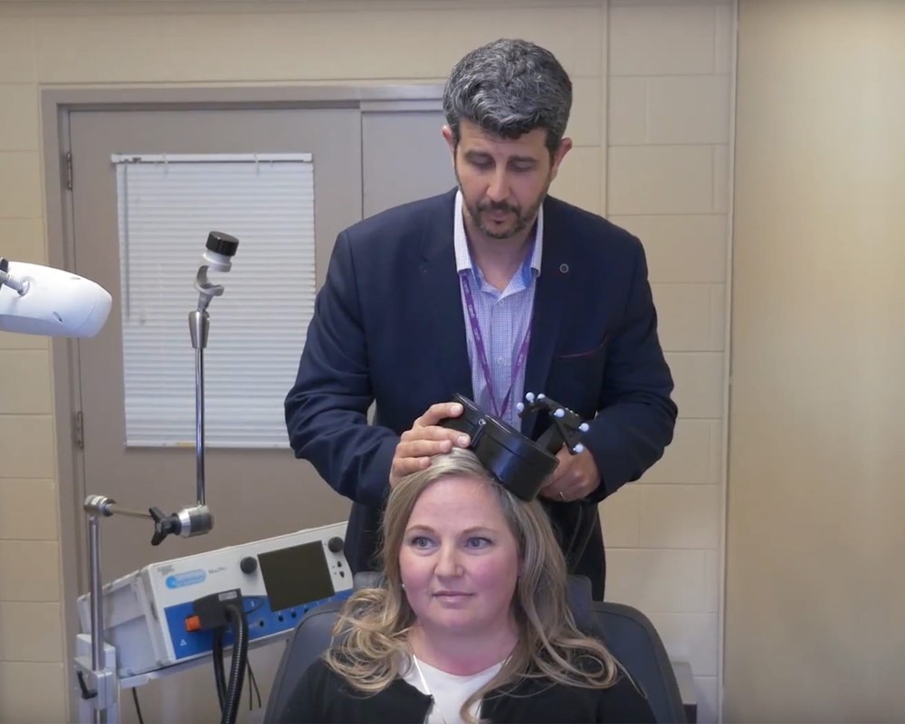 Dr. Daniel Blumberger demonstrates intermittent theta burst stimulation