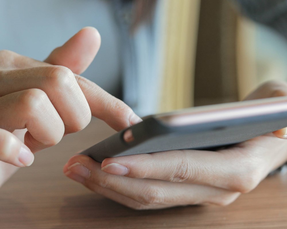 Close-up of person using phone