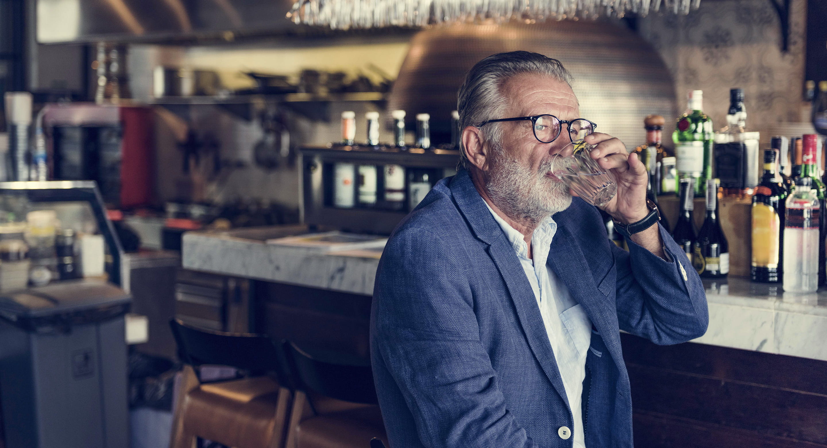 Older man drinking