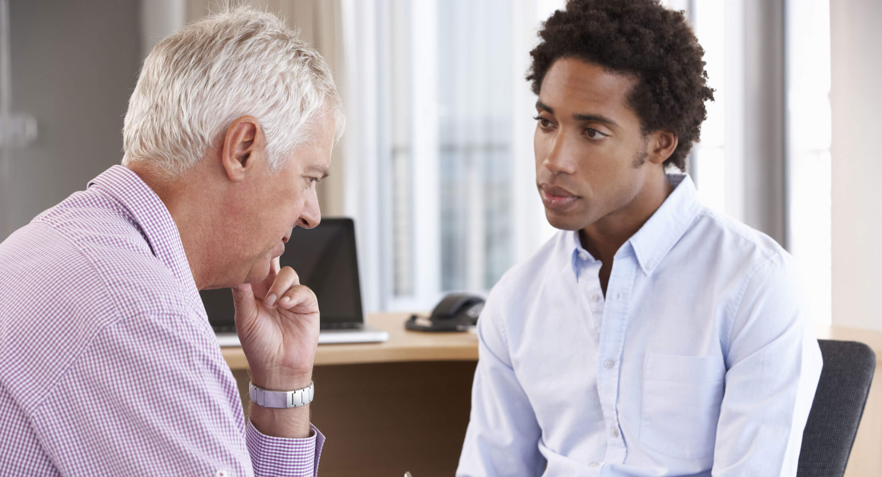 Older man and younger doctor