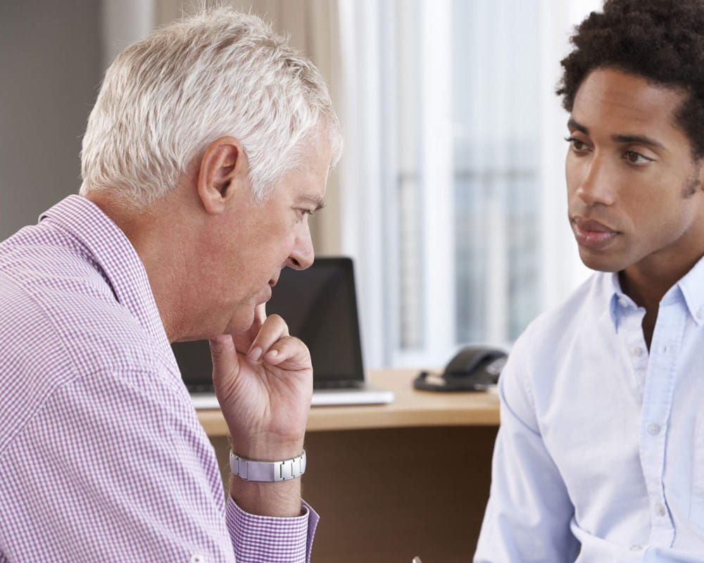 Older man and younger doctor