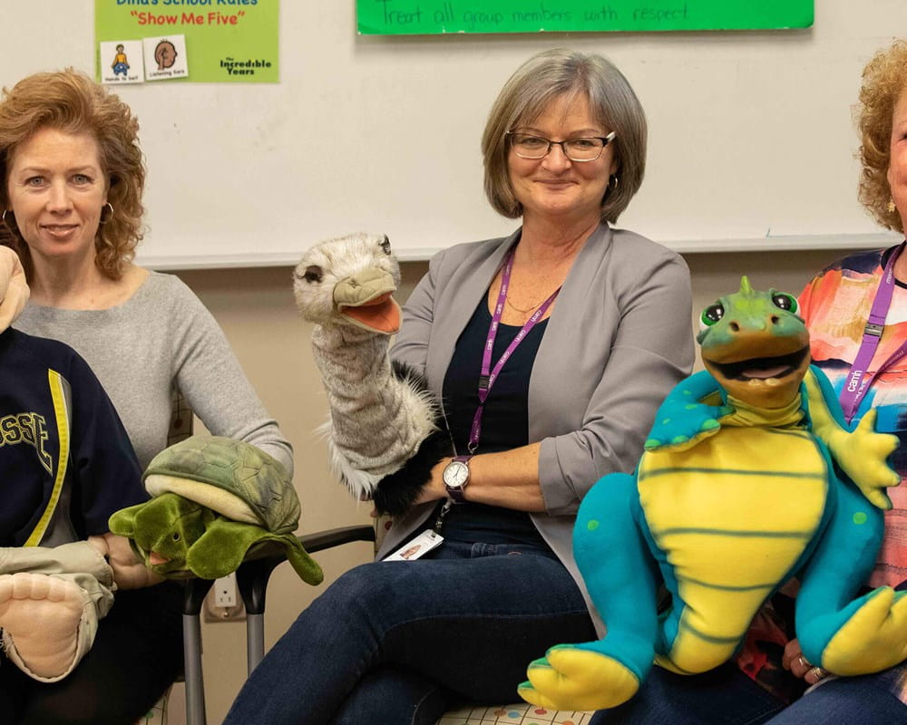 Janine De Rosie, Susan Lytle and MaryLynn Reddon D’Arcy displaying puppets