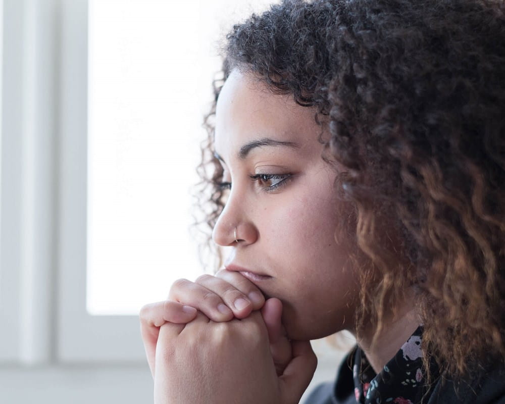 Young woman looking sad