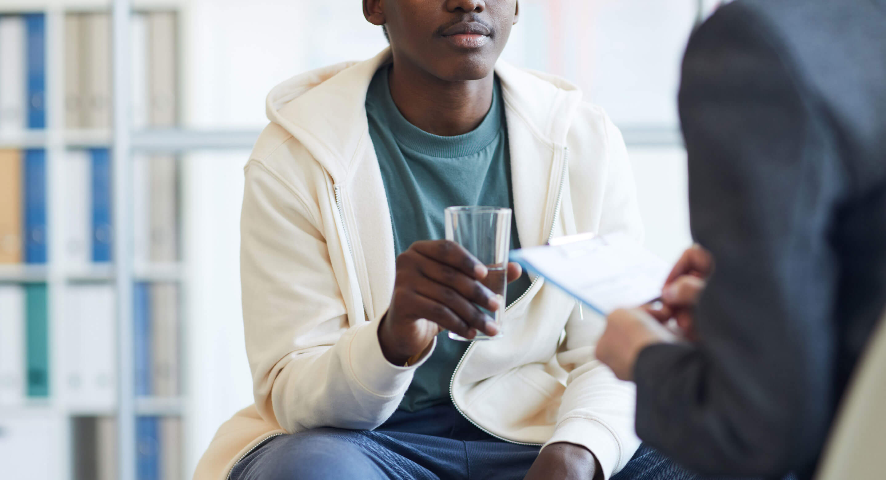 Stock photo of teenager in therapy session