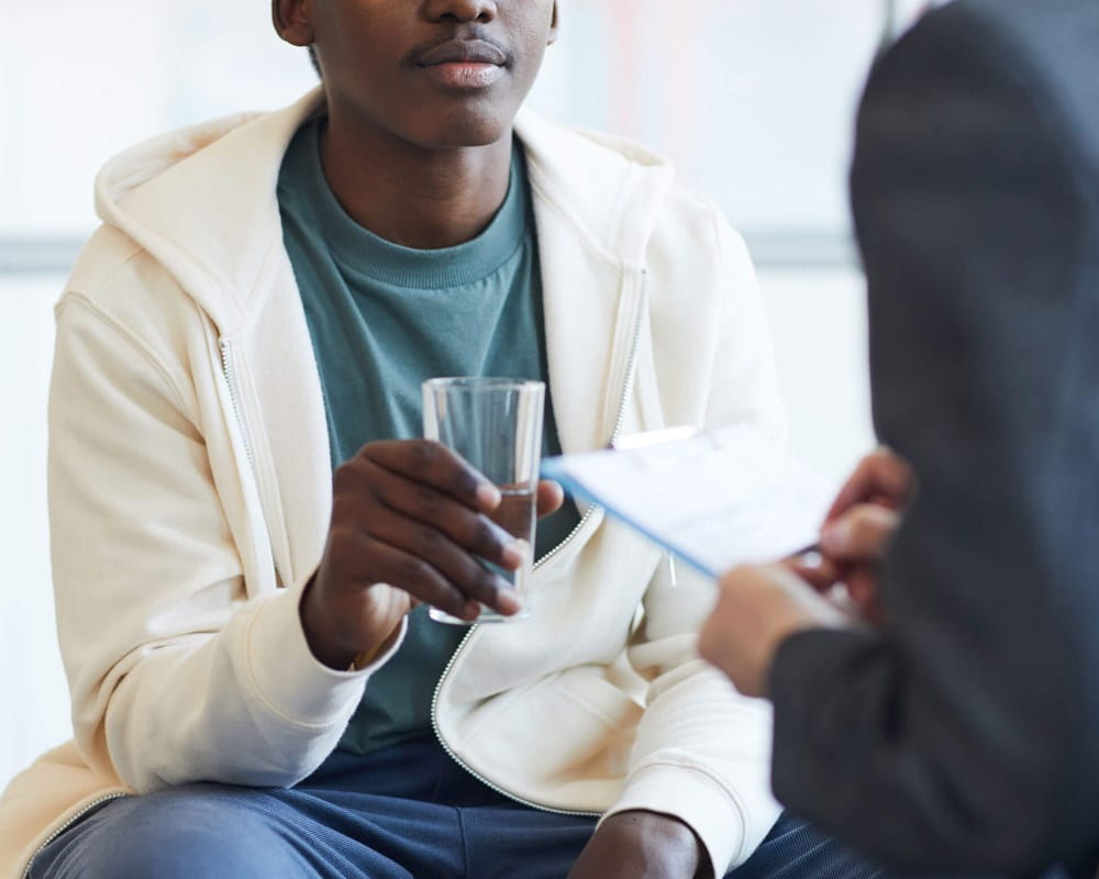 Stock photo of teenager in therapy session