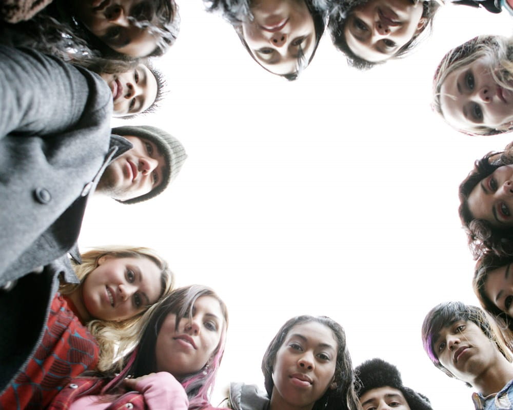 Photo of youth in a circle