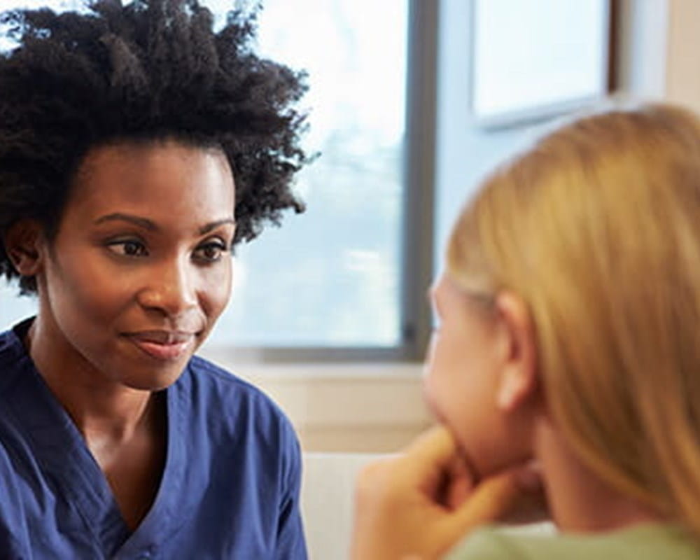 Nurse listening to a teen.