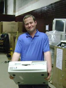 Pat carrying a cardboard box. 