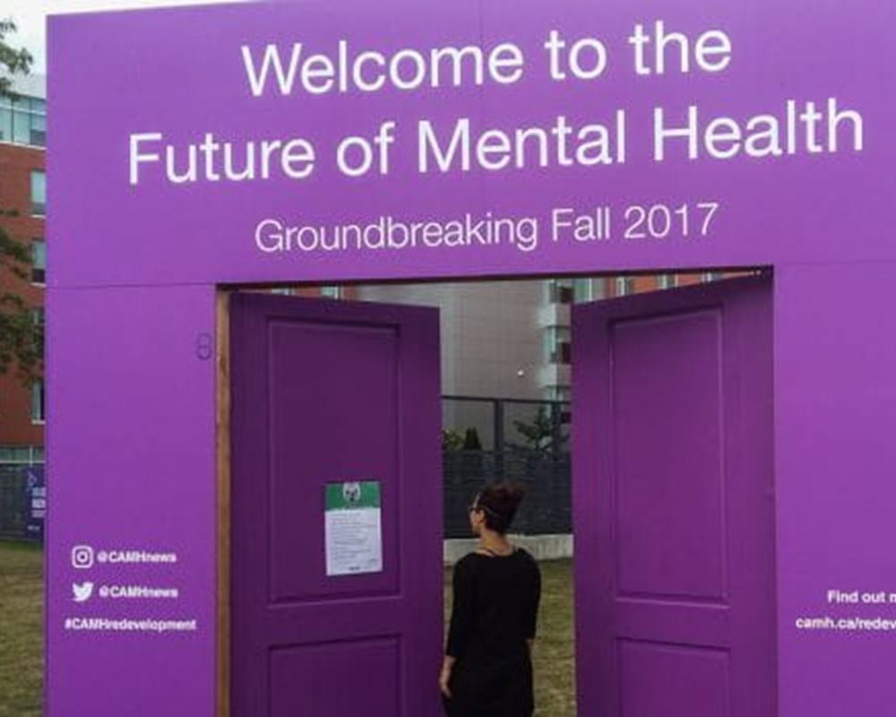 A set of purple doors outside of CAMH with the phrase