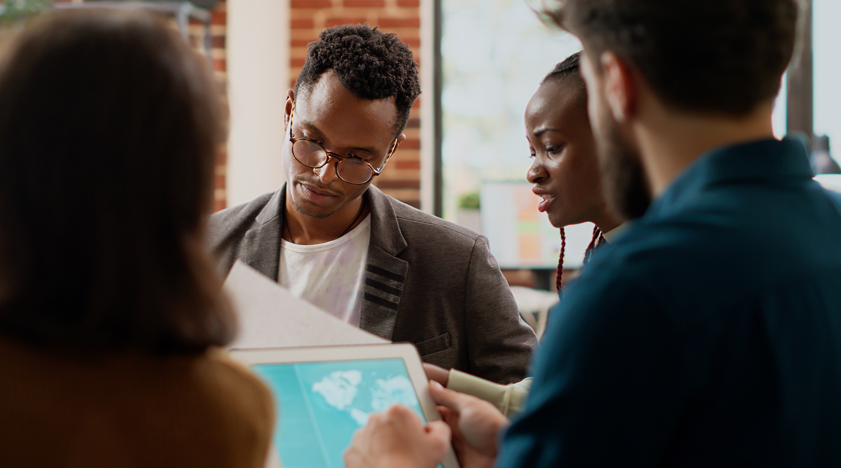Diverse team of professionals reviewing data