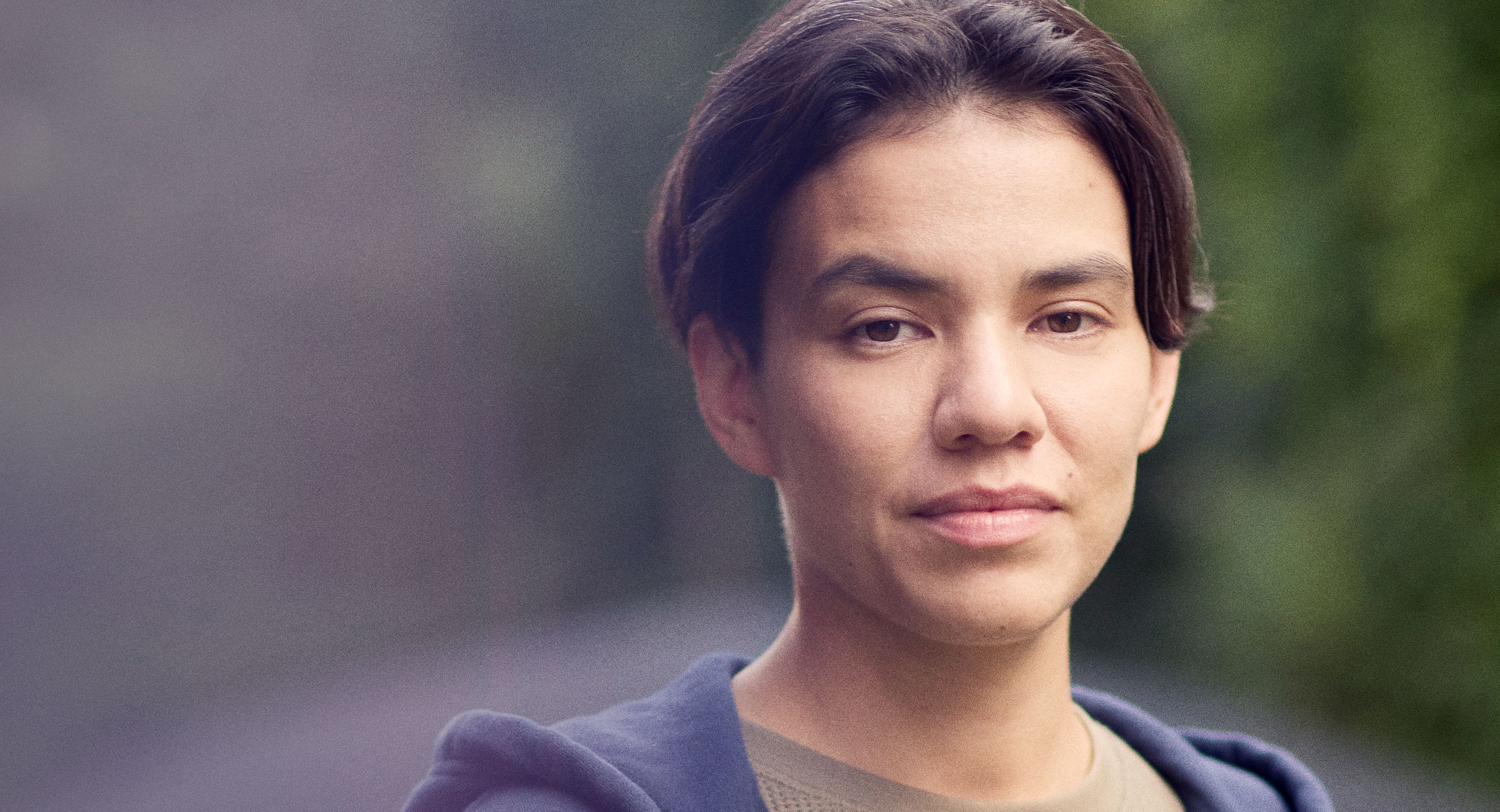 Indigenous male youth facing camera