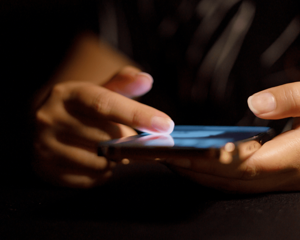 Person scrolling on phone