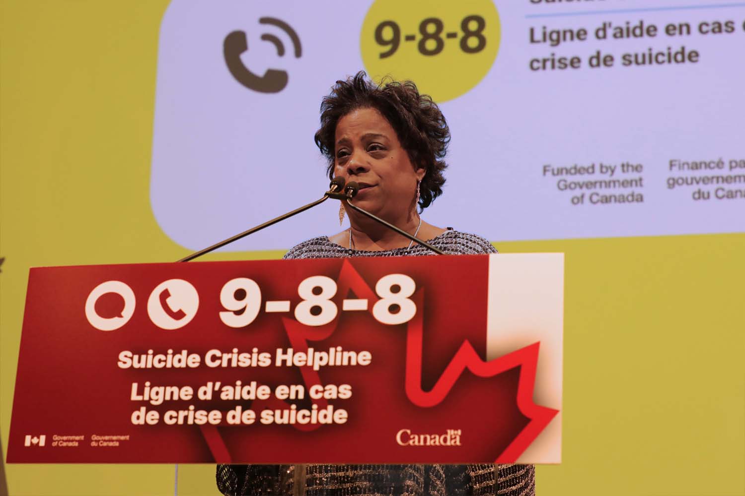 Minister Michel at the 988 Podium