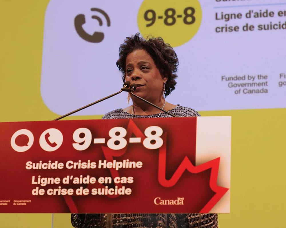 Minister Michel at the 988 Podium