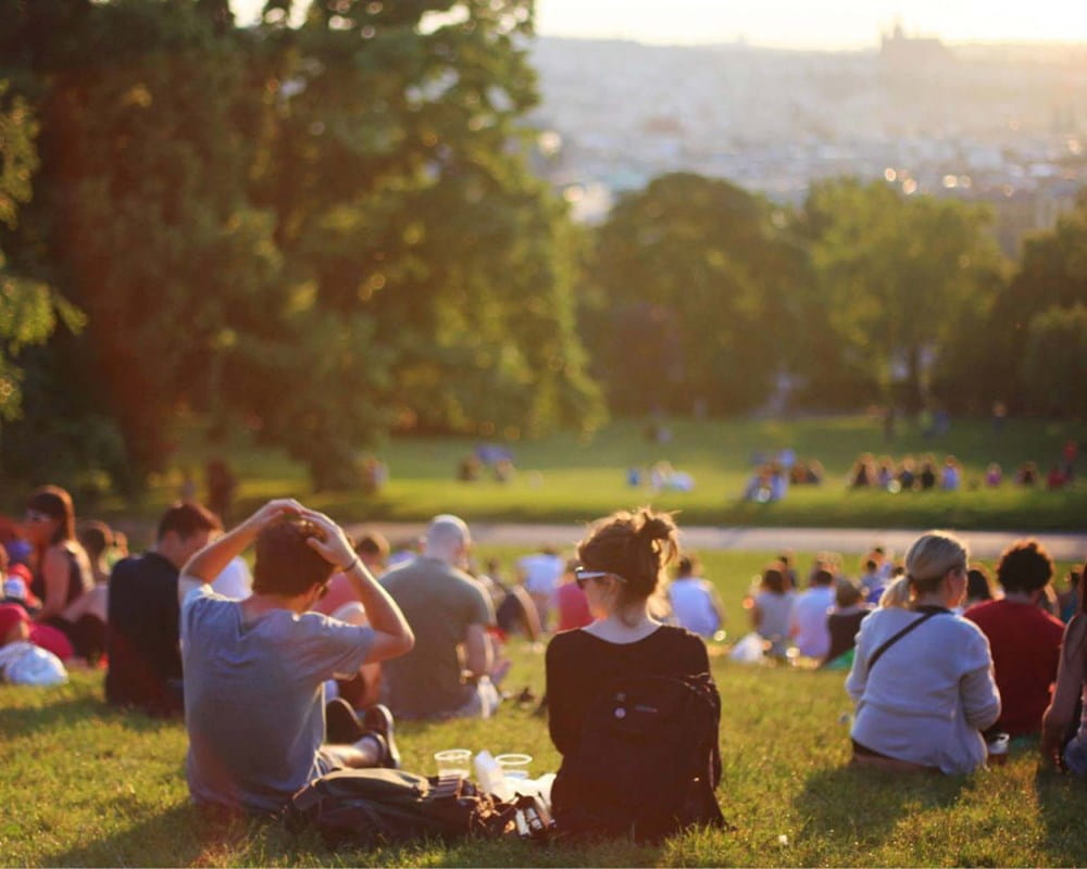 Group of people sitting in a park