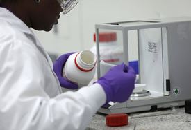 Woman scientist measuring content